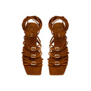 Catena Notte Camello flat lace-up sandal with suede straps and metallic details, perfect for summer adventures.