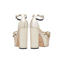 Back view of Catena Sahara Platform Ankle Sandal in shimmering sahara-gold leather with chunky block heels.