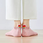 Chaussette avec languette cœur arc-en-ciel.
