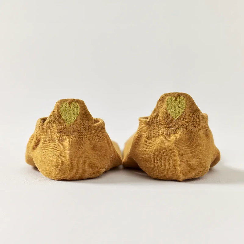 Chaussettes jaune en coton à languette cœur doré pour femme 