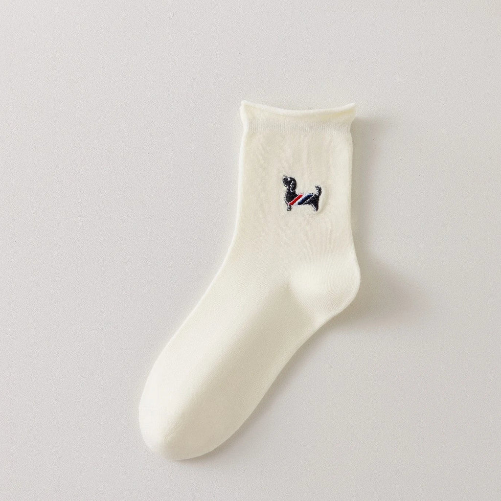 Chaussette femme crème vendue à l’unité avec broderie chien ou chat. Maille douce, bord roulotté et taille unique 35-41. Confort et fantaisie garantis.