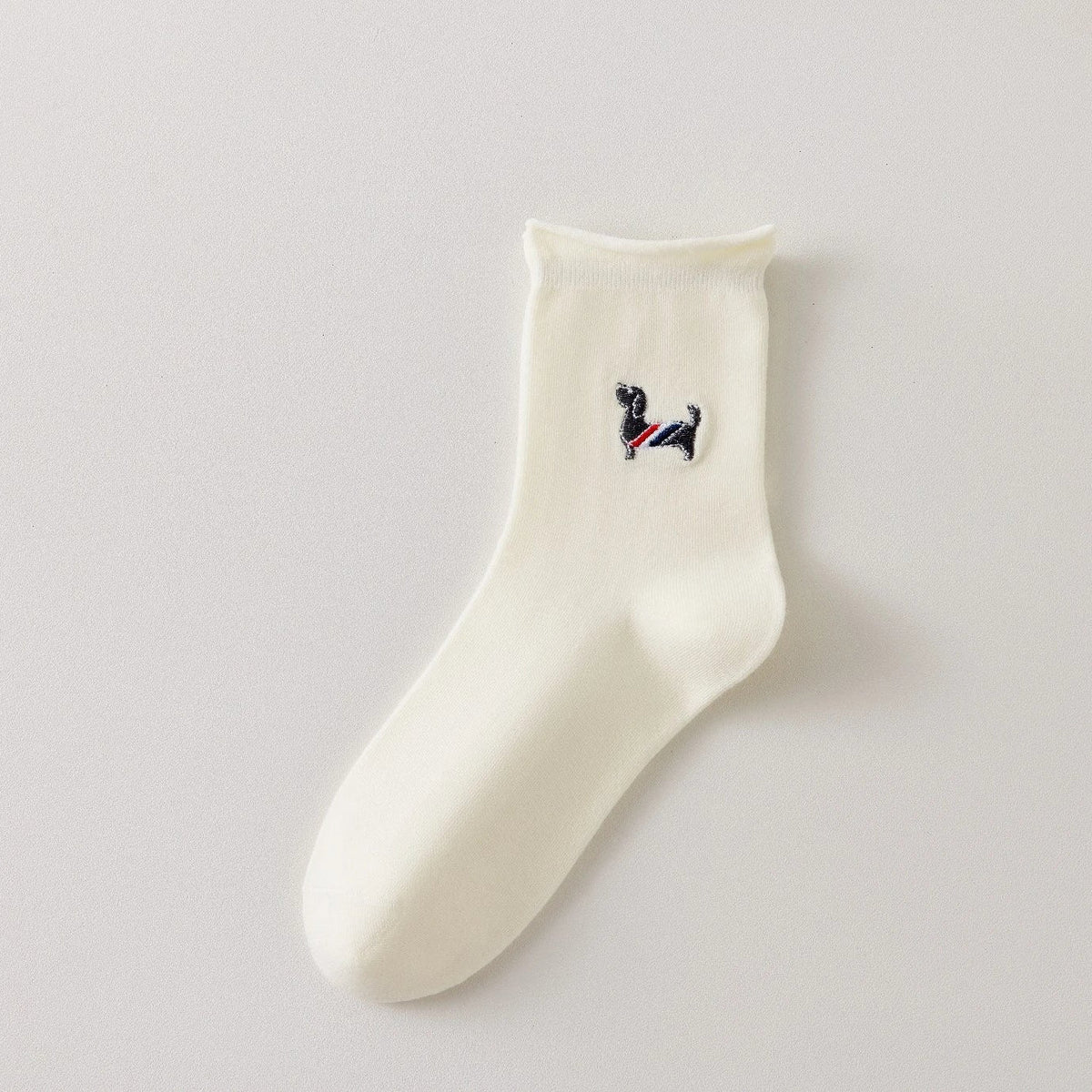 Chaussette femme crème vendue à l’unité avec broderie chien ou chat. Maille douce, bord roulotté et taille unique 35-41. Confort et fantaisie garantis.