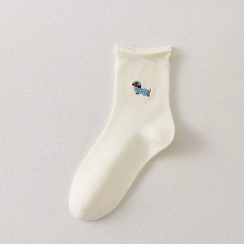 Chaussette femme crème vendue à l’unité avec broderie chien ou chat. Maille douce, bord roulotté et taille unique 35-41. Confort et fantaisie garantis.