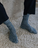 chaussette homme chinée beige clair Angarde porté tapis