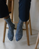 Angarde navy blue mottled men's sock worn on the ground