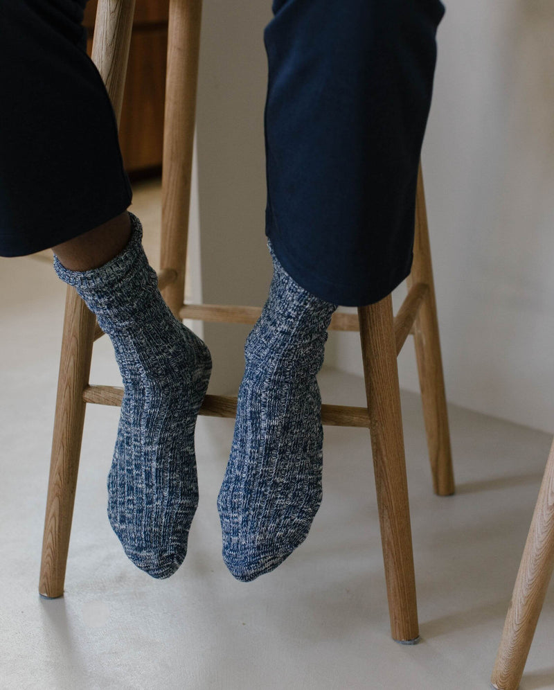 Angarde navy blue mottled men's sock worn on the ground