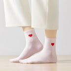 Chaussettes longues roses adultes en coton avec un cœur rose sur le côté 