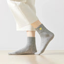 Chaussette haute chaude avec cœur doré brodé.