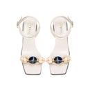 Delphine 50MM Ankle Cross Sandal in ivory with aqua beads and wide straps, blending nature-inspired colors.