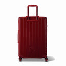 Vue arrière de la valise rigide GYL Intemporelle rouge foncé avec poignées intégrées et roulettes pivotantes. #couleur_rouge foncé