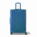 Vue arrière de la valise rigide GYL Intemporelle noir avec poignées intégrées et roulettes pivotantes. #couleur_bleu grisé