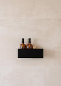 Duschablage SHEA con dos botellas en un estilo negro Regal in der Dusche