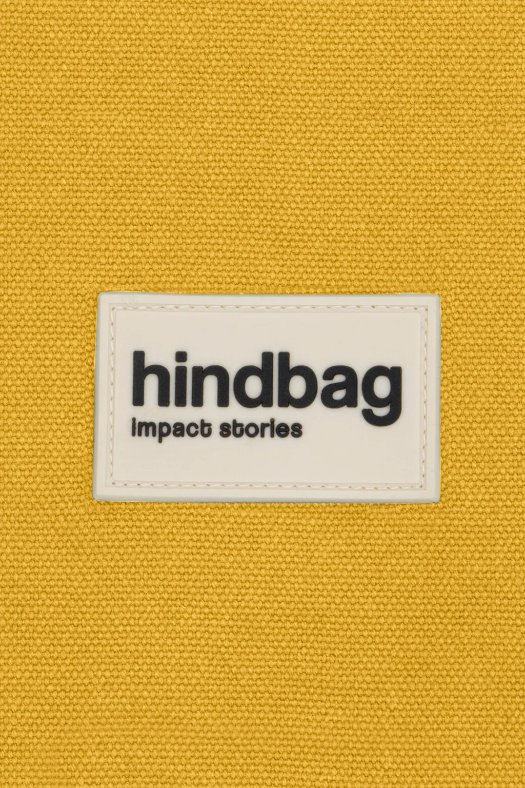 DETTAGLIO dell'etichetta Hindbag in silicone color zafferano