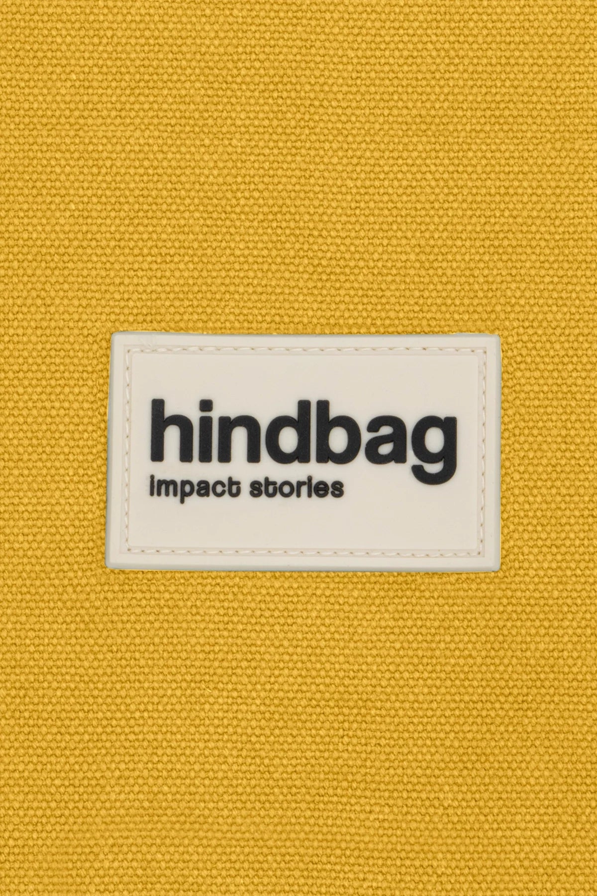 DETTAGLIO dell'etichetta Hindbag in silicone color zafferano