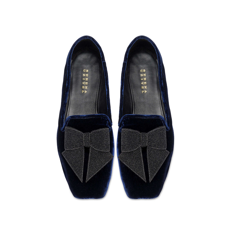 Fiocco Navy Flat Moccasin featuring elegant black embroidered bow on luxurious navy velvet, perfect for chic fall style.