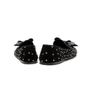 Rear view of Fiocco Studs Flat Moccasin in black suede, adorned with sparkling crystal studs and a studded bow.