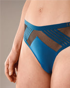 woman wearing a hastko seamless sports tanga TANGA N°23 #color_tropico-blue