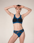woman wearing a hastko seamless sports tanga TANGA N°23 #color_tropico-blue