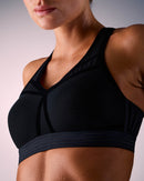 woman wearing a hastko BRA N°38 sports bra #color_true-black