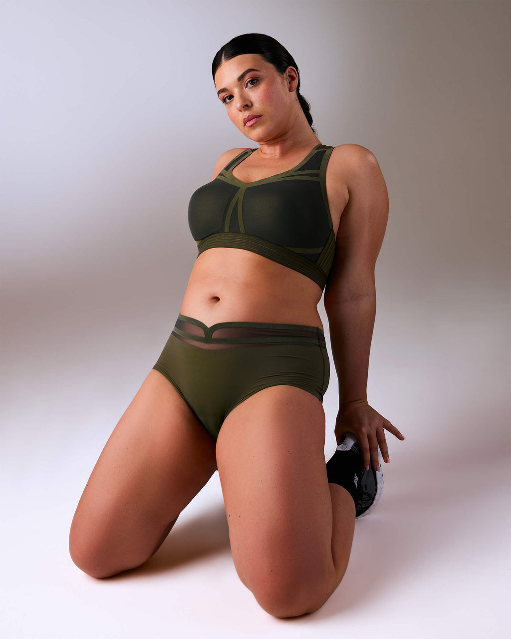 woman wearing a hastko BRA N°38 sports bra #color_kaki