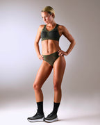 woman wearing a hastko BRA N°38 sports bra #color_kaki