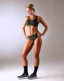 woman wearing a hastko BRA N°38 sports bra #color_kaki