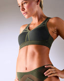 woman wearing a hastko BRA N°38 sports bra #color_kaki