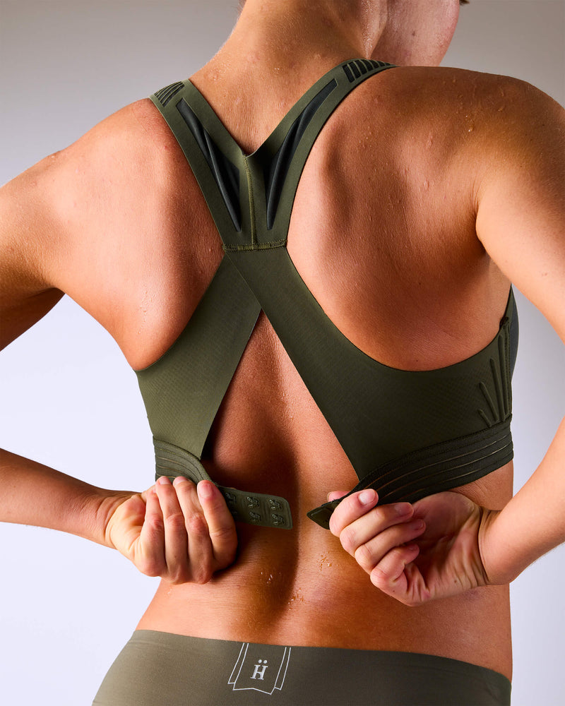 woman wearing a hastko BRA N°38 sports bra #color_kaki