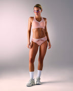 woman wearing a hastko BRA N°38 sports bra #color_nude