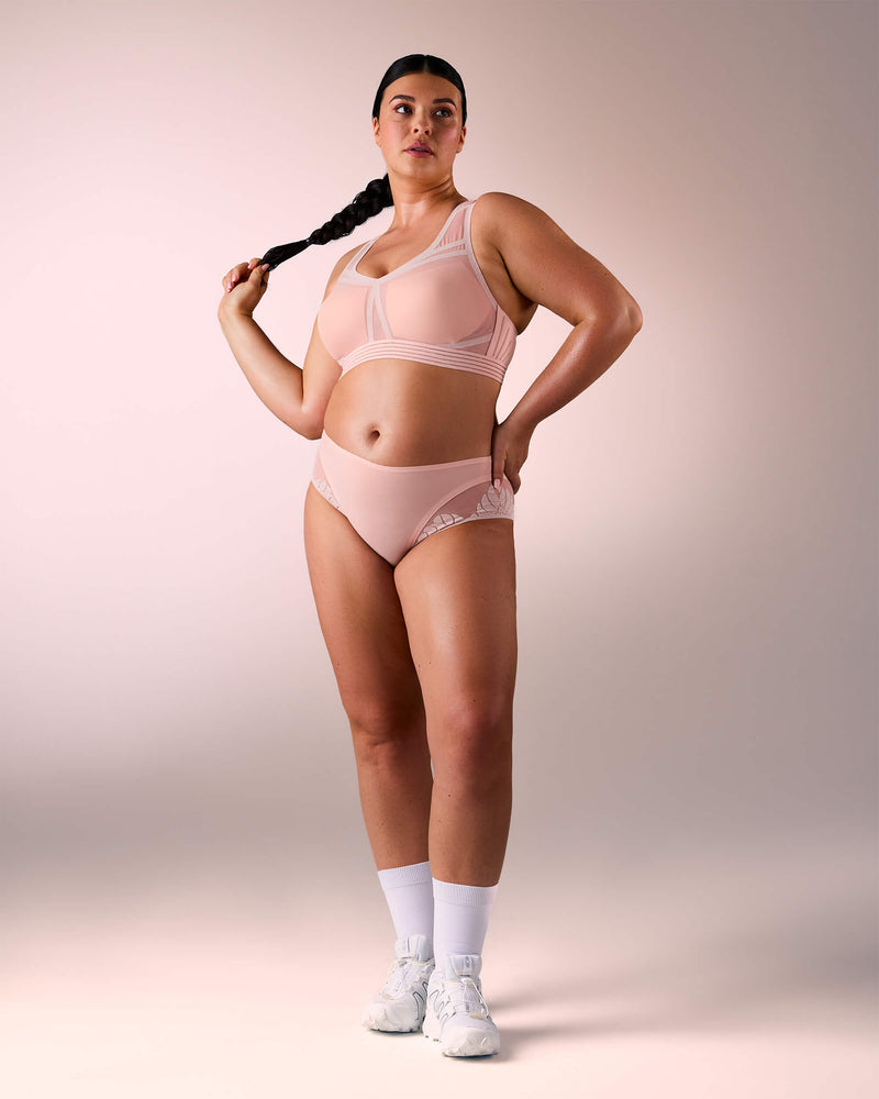 woman wearing a hastko BRA N°38 sports bra #color_nude