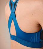 woman wearing a sports bra #color_tropico-blue