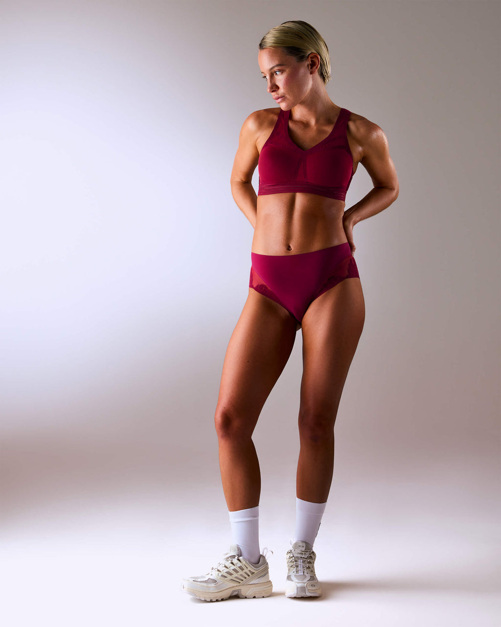 woman wearing a hastko BRA N°38 sports bra #color_tuscany-bordeaux