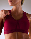 woman wearing a hastko BRA N°38 sports bra #color_tuscany-bordeaux