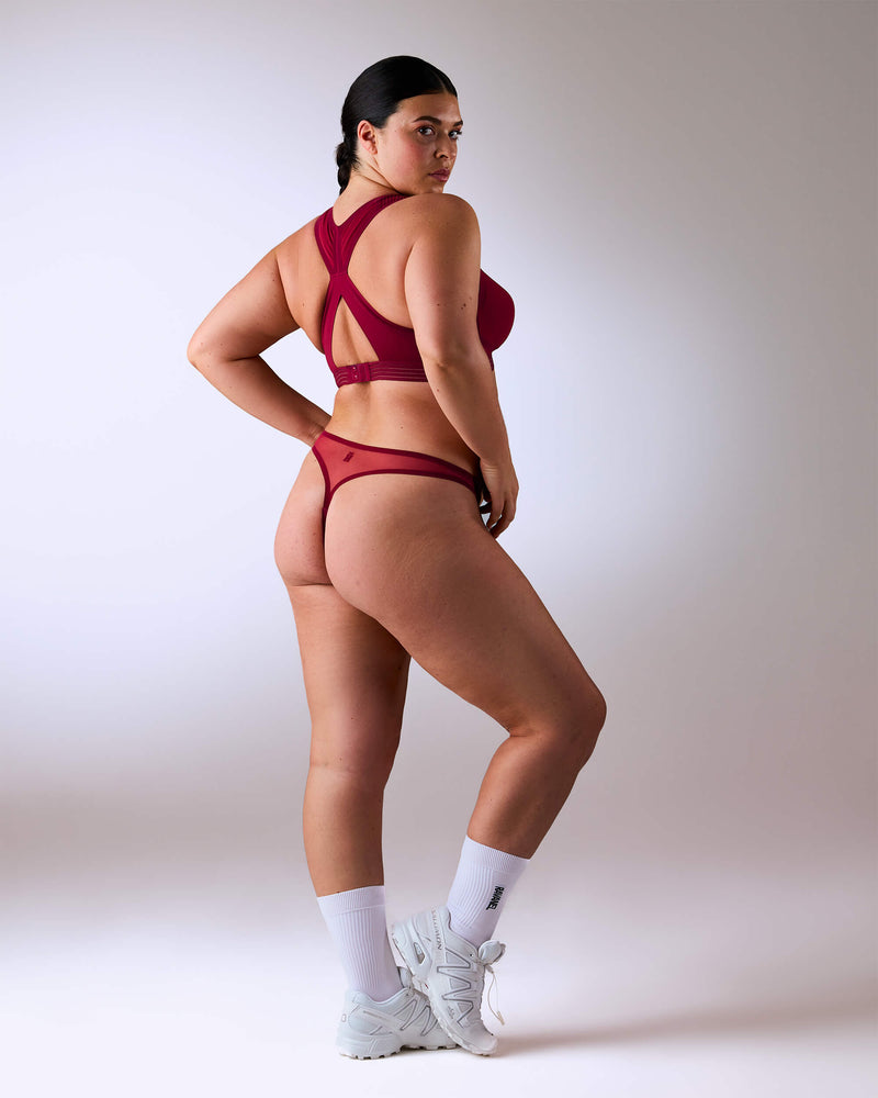 woman wearing a hastko BRA N°38 sports bra #color_tuscany-bordeaux