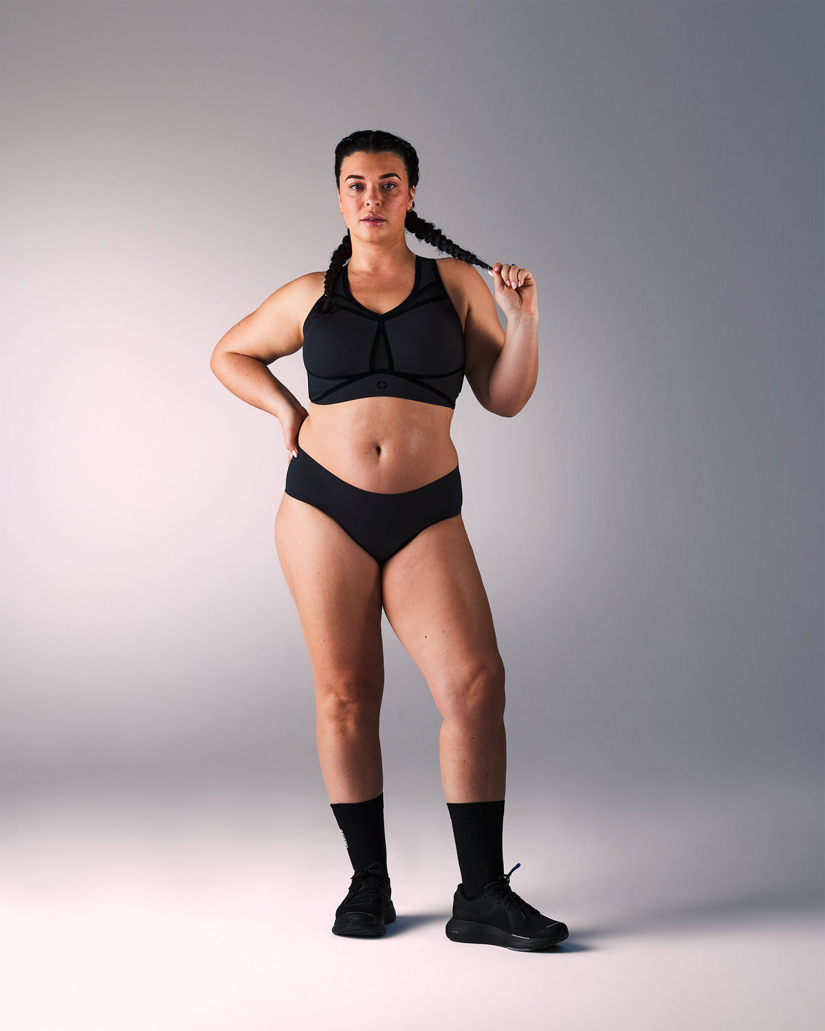 woman wearing a hastko BRA N°39 sports bra #color_true-black
