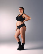 woman wearing a hastko BRA N°39 sports bra #color_true-black