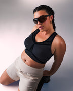 woman wearing a hastko BRA N°39 sports bra #color_true-black