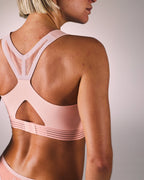 woman wearing a hastko BRA N°39 sports bra #color_nude