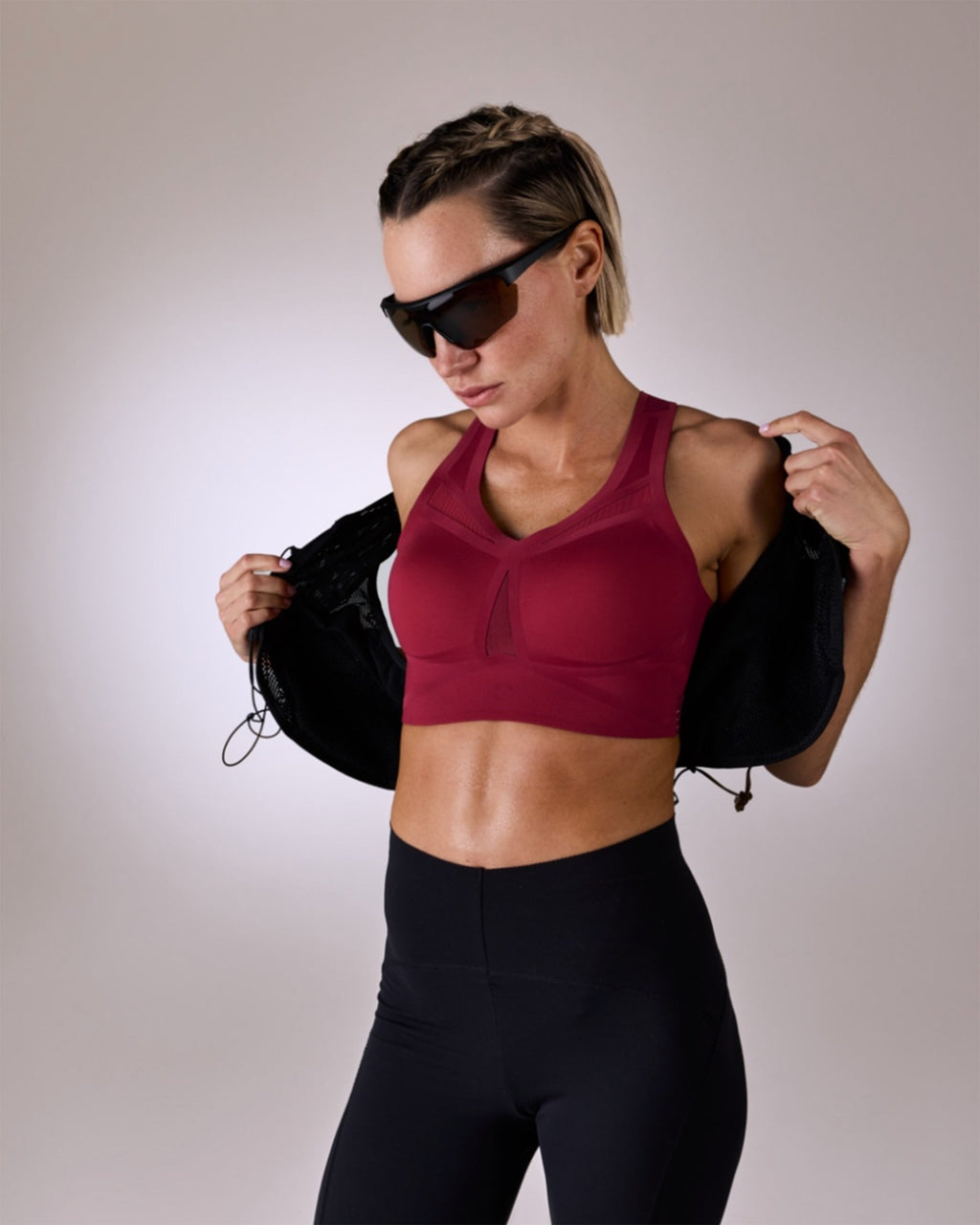 woman wearing a hastko BRA N°39 sports bra #color_tuscany-bordeaux