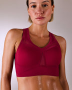 woman wearing a hastko BRA N°39 sports bra #color_tuscany-bordeaux