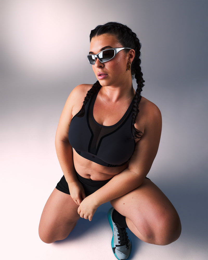 woman wearing a hastko BRA N°42 sports bra #color_true-black