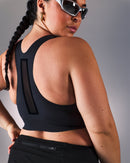 woman wearing a hastko BRA N°42 sports bra #color_true-black