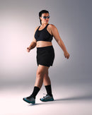 woman wearing a hastko BRA N°42 sports bra #color_true-black