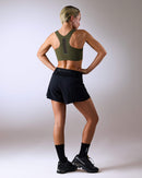 woman wearing a hastko BRA N°42 sports bra #color_kaki