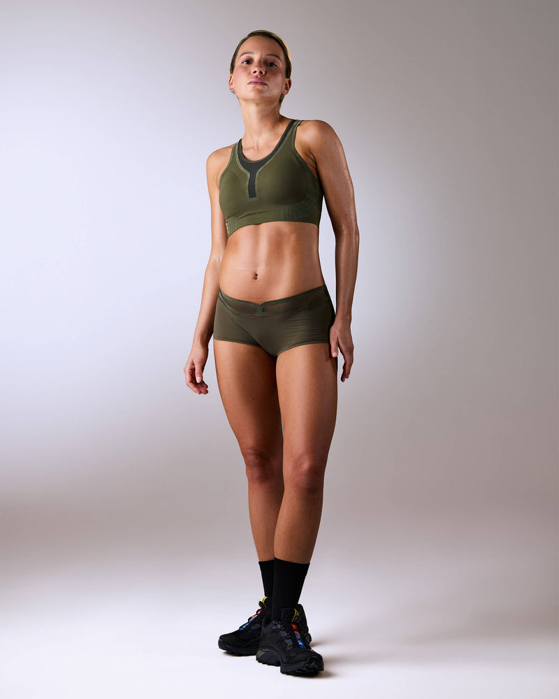 woman wearing a hastko BRA N°42 sports bra #color_kaki