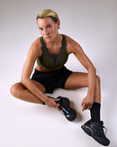 woman wearing a hastko BRA N°42 sports bra #color_kaki