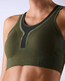 woman wearing a hastko BRA N°42 sports bra #color_kaki