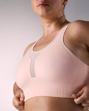 woman wearing a hastko BRA N°42 sports bra #color_nude