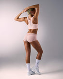 woman wearing a hastko BRA N°42 sports bra #color_nude