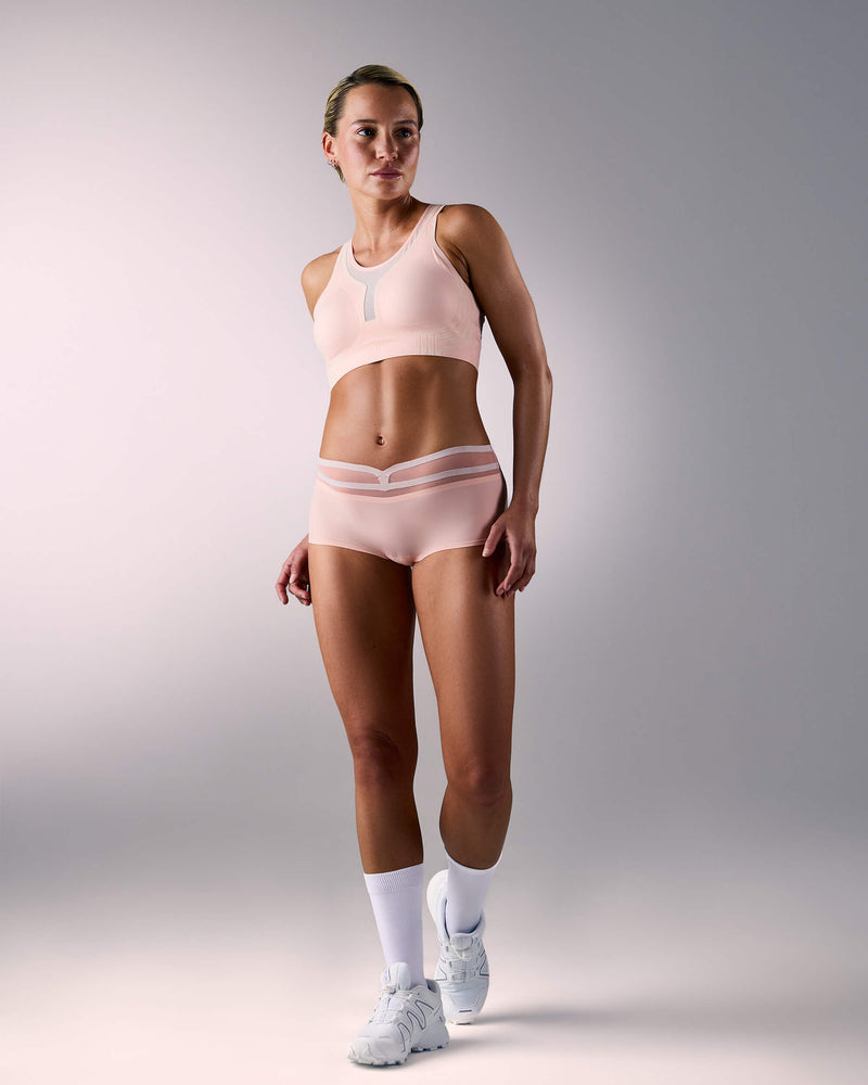 woman wearing a hastko BRA N°42 sports bra #color_nude
